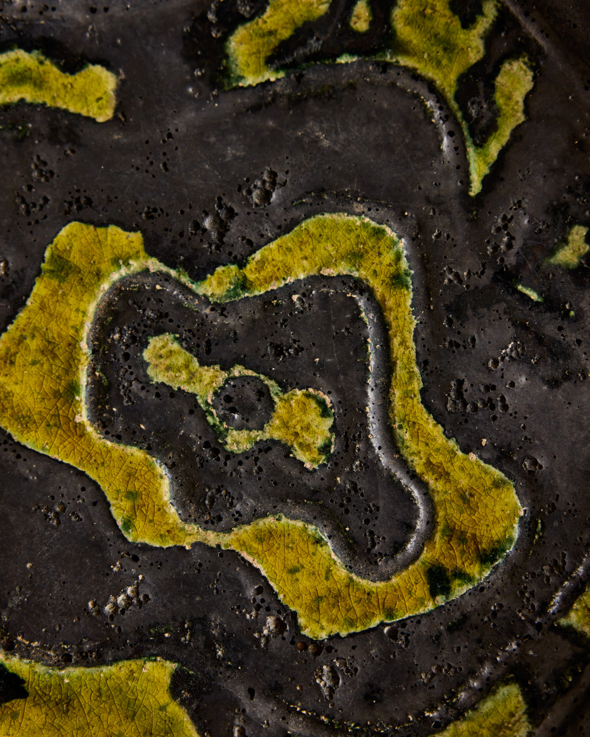 Black Ceramic Plate with Yellow Glaze