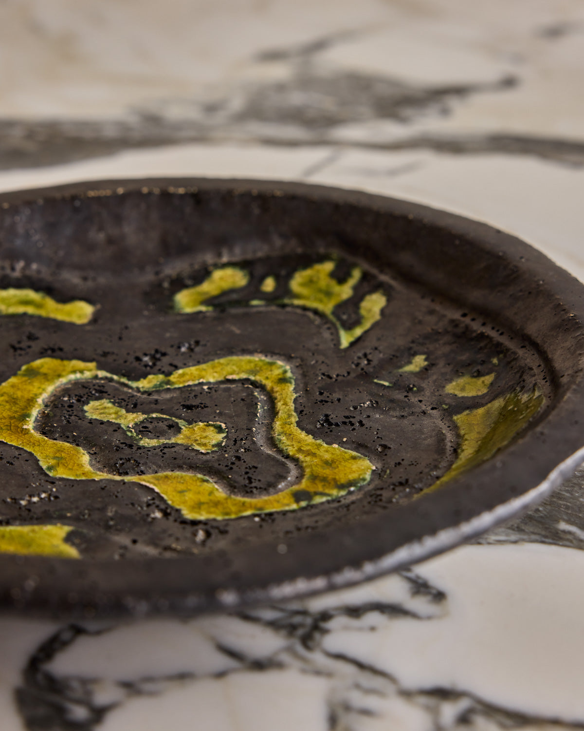 Black Ceramic Plate with Yellow Glaze