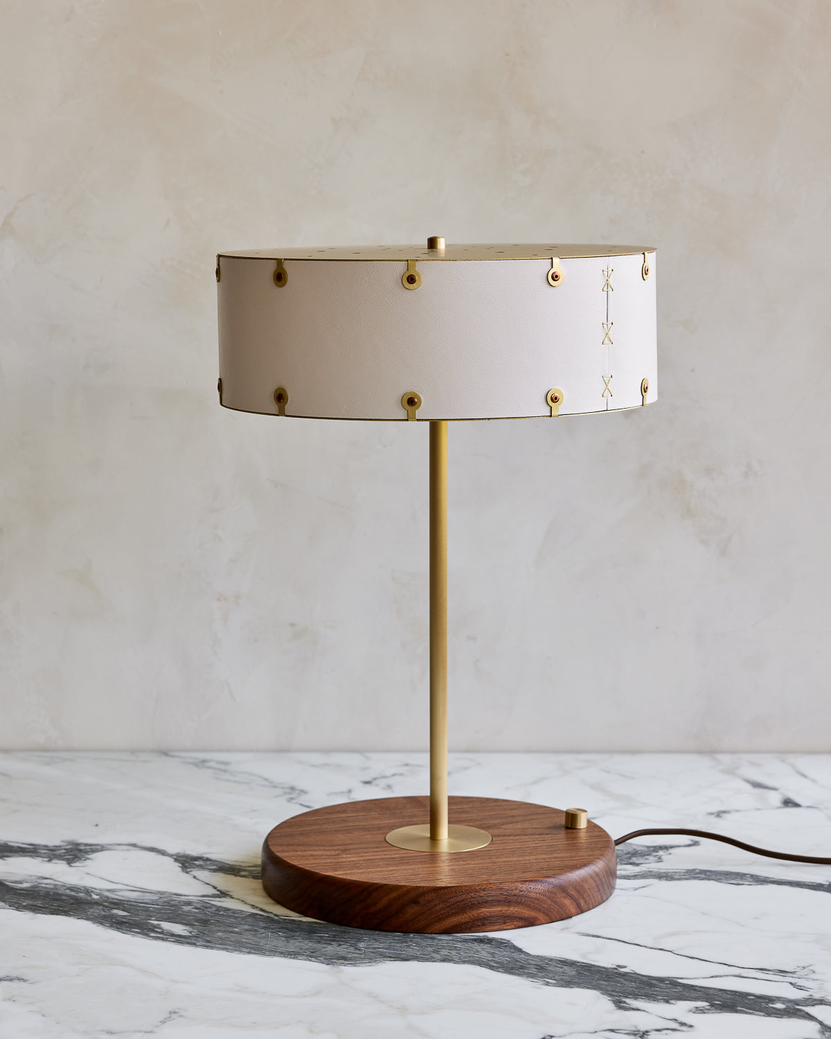 Brass table lamp with walnut base and white leather shade