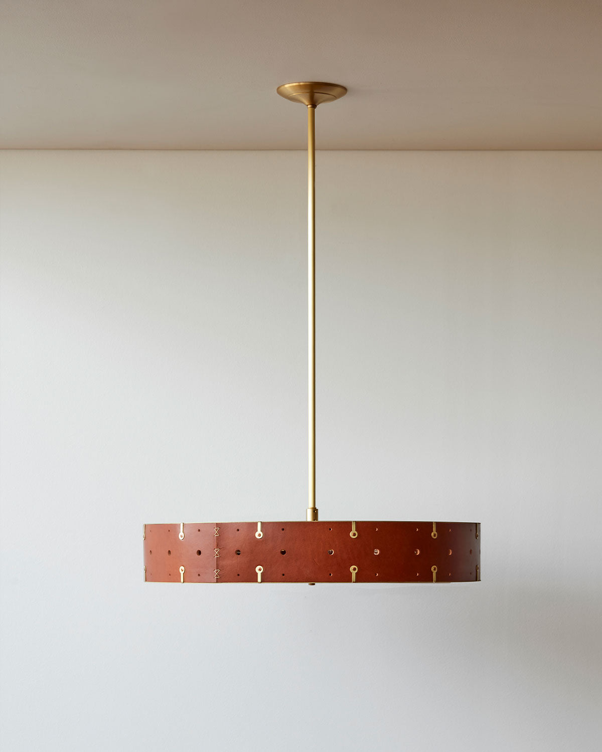 Beautiful satin brass ceiling pendant fixture with handstitched leather drum shade and customizable drop