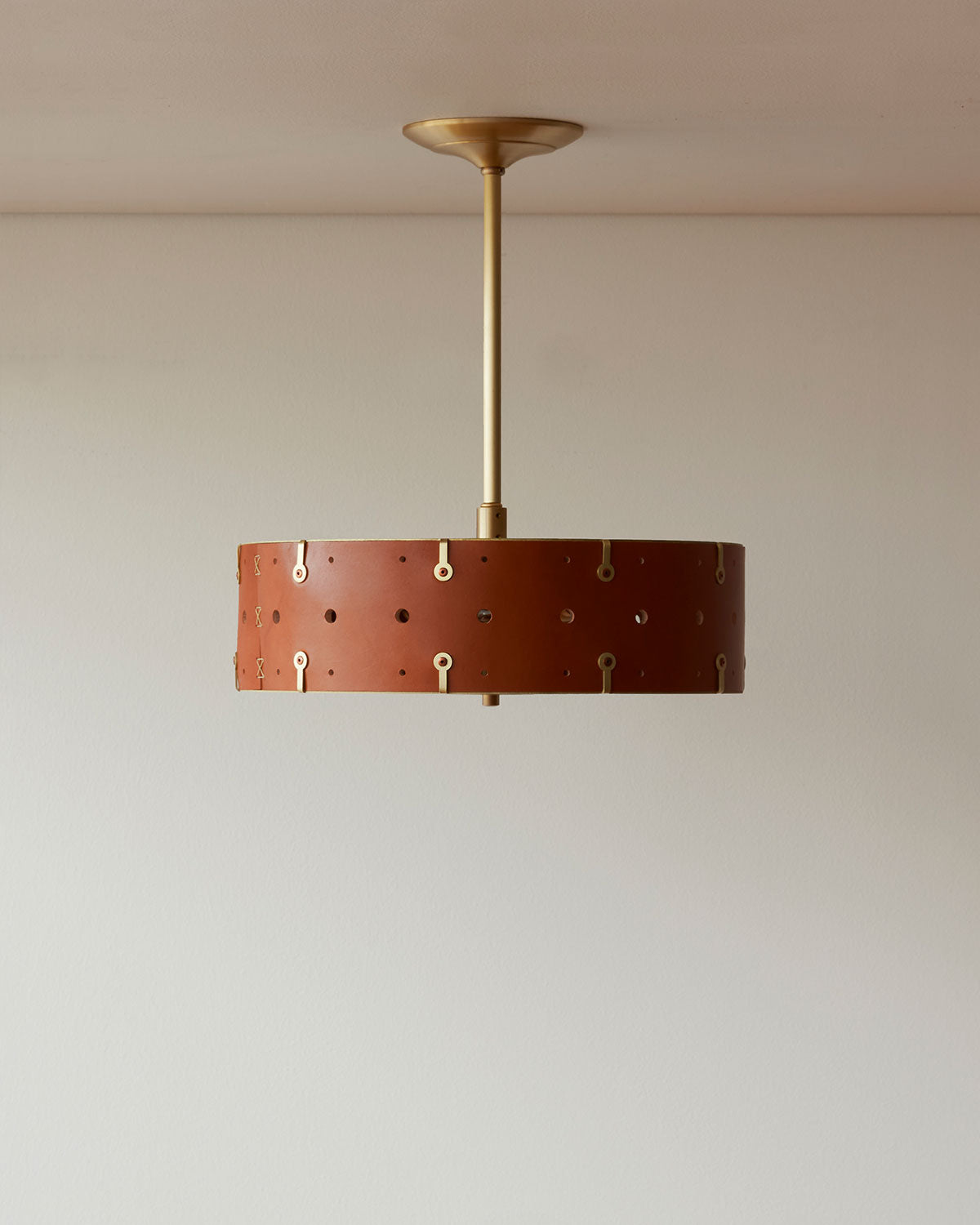 Beautiful satin brass ceiling pendant fixture with handstitched leather drum shade and customizable drop