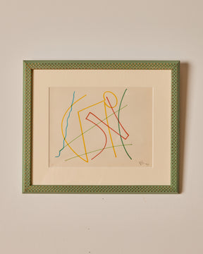 Framed abstract artwork with colorful lines on a beige background