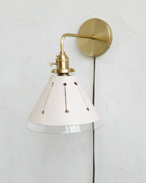 Classic satin brass plug in wall sconce with cone glass diffuser and decorative handstitched leather shade