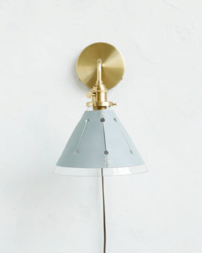 Classic satin brass plug in wall sconce with cone glass diffuser and decorative handstitched leather shade