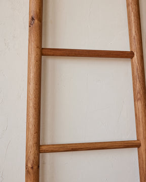 Reclaimed white oak decorative ladder from Lostine. Simple interior design, made in the USA. Warm American Modern Design