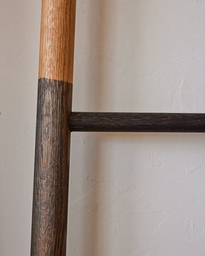 Reclaimed white oak oxidized decorative ladder from Lostine. Simple interior design, made in the USA. Warm American Modern Design