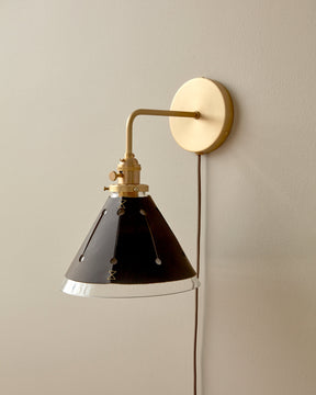 Classic satin brass plug in wall sconce with cone glass diffuser and decorative handstitched leather shade