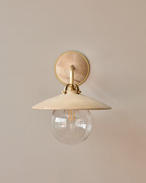 Hardwired satin brass wall sconce with decorative wooden clear maple shade and glass globe