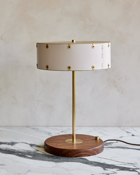 Brass table lamp with walnut base and white leather shade