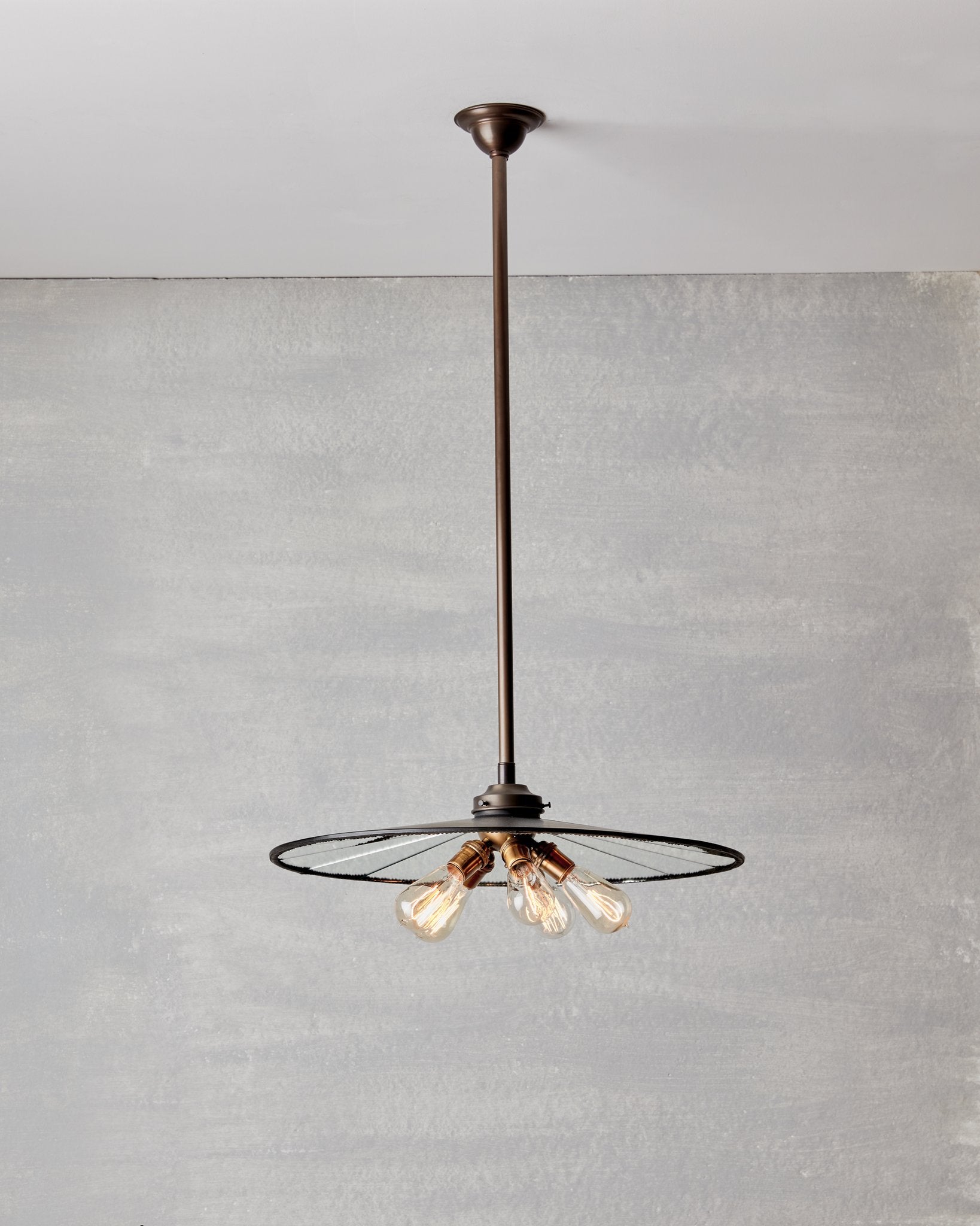 Large flat mirrored ceiling pendant with exposed lightbulbs. Made by RTO Lighting in Philadelphia. Hardwired light fixture. Simple interior design, made in the USA.