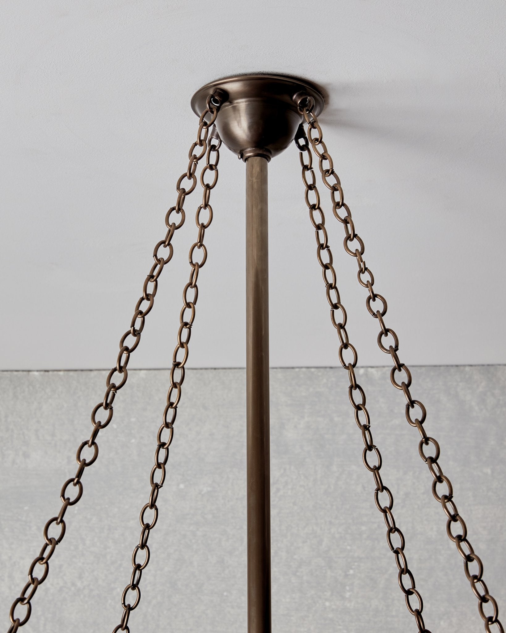 Victorian style metal chandelier with mirrored interior and edison bulbs