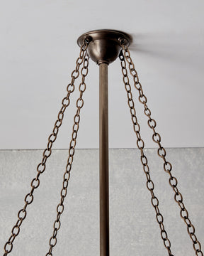 Victorian style metal chandelier with mirrored interior and edison bulbs
