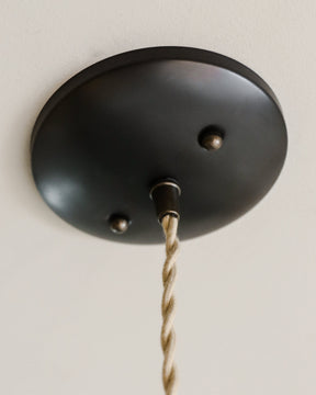 Classic cone pendant with hand-stitched decorative leather shade and glass diffuser